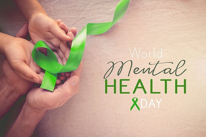 Adult and child hands holding Lime GreenRibbon, world Mental hea