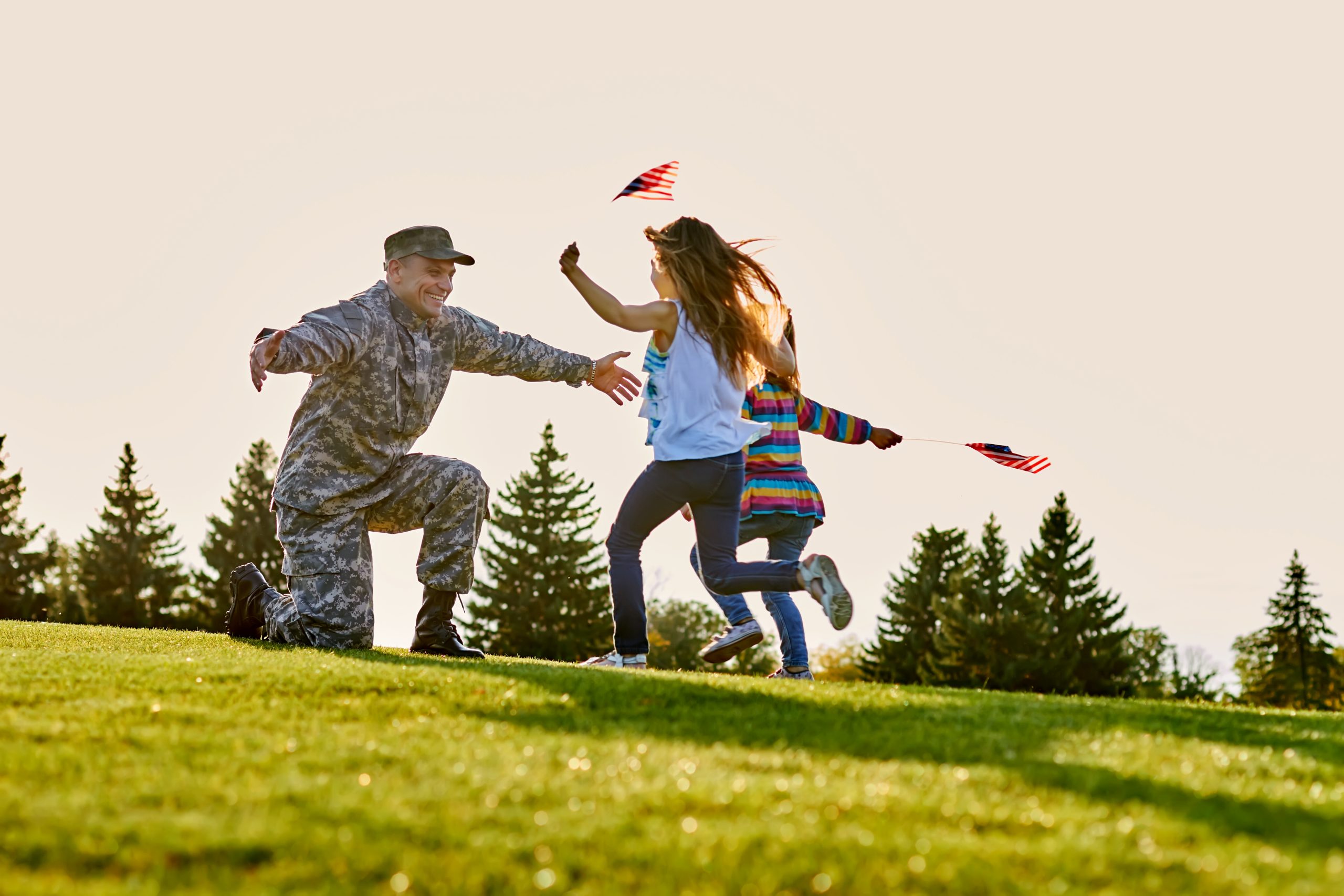 American military veteran coming home with open arms for his happy daughters