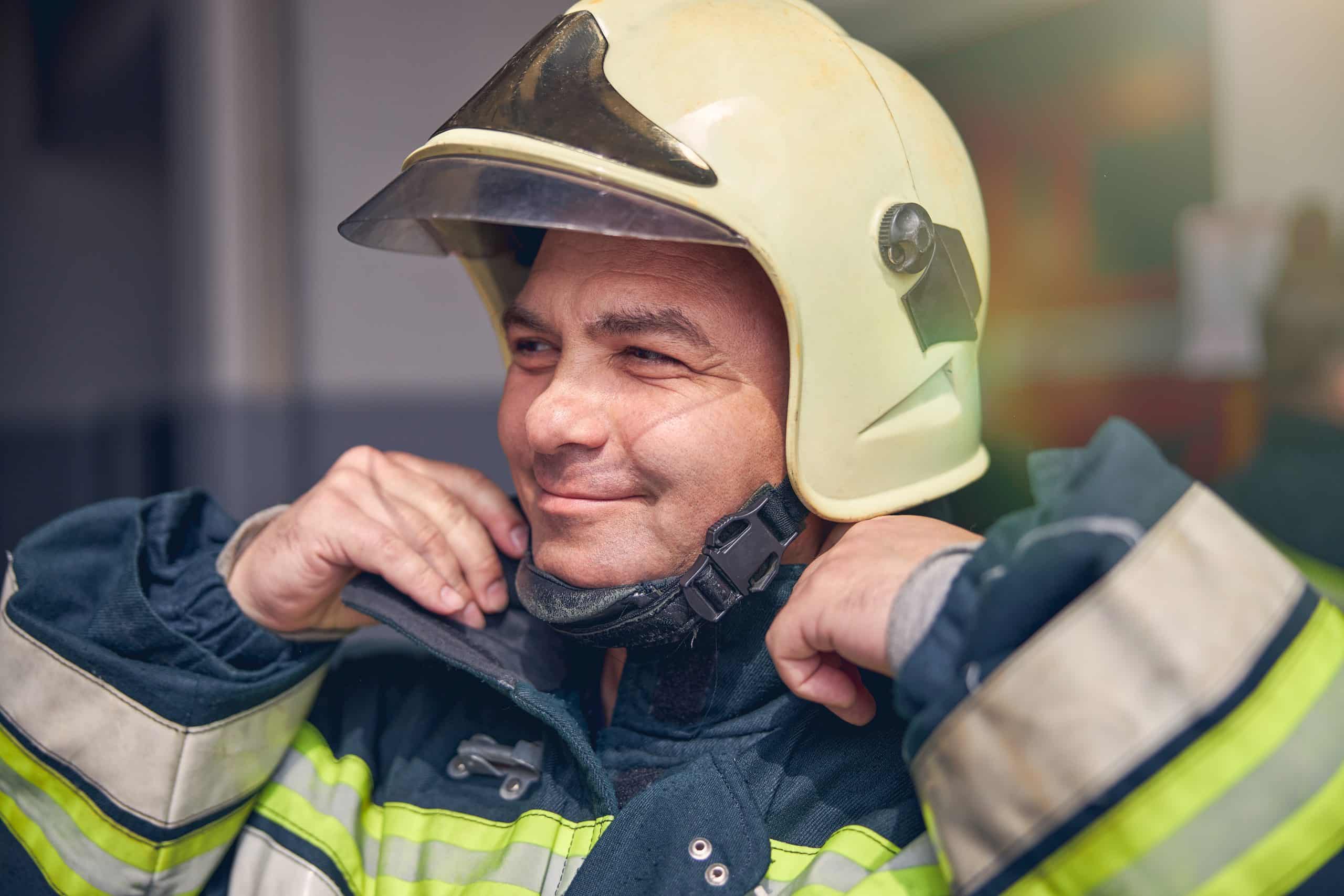 Firefighter first responder smiling with resilience, resilience for first responders